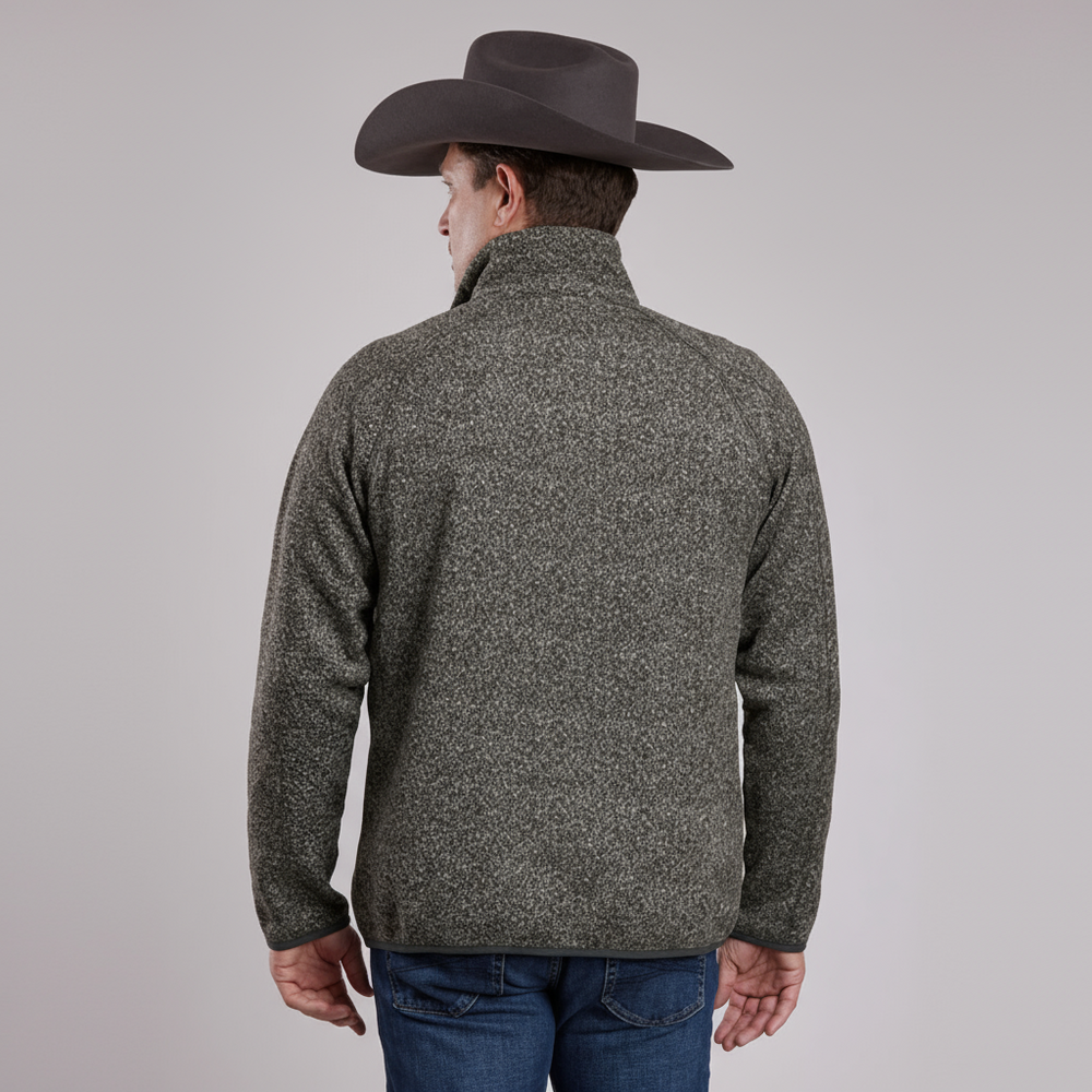 Person wearing a gray fleece jacket and cowboy hat on a light gray background
